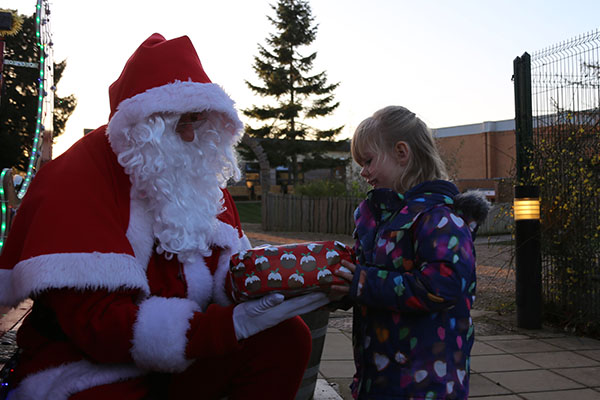 Santa visits the Stamford Nursery School to receive donated gifts